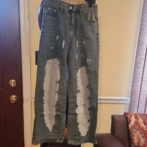 Distressed Blue Jeans, sheer on both legs size tag Say Med. Too small for me :(